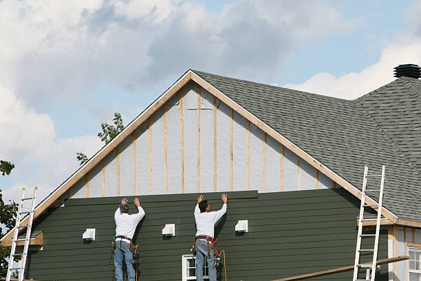 Professional Siding technician working in Westwood, MA